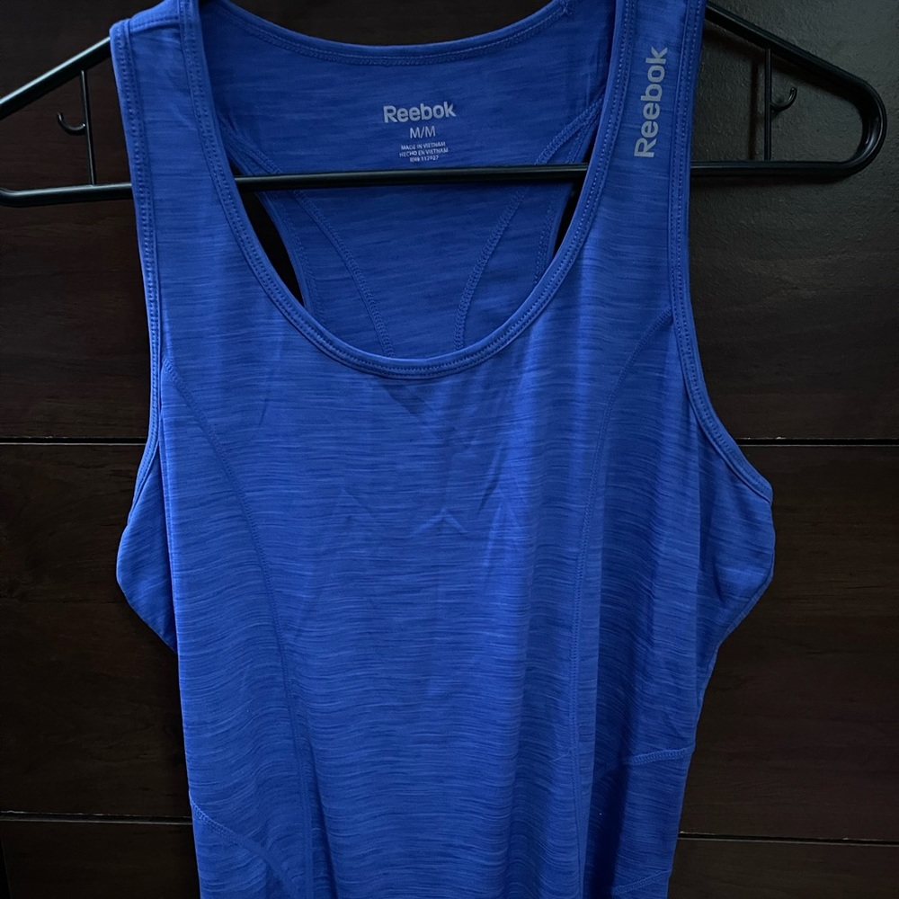 Reebok tank top.